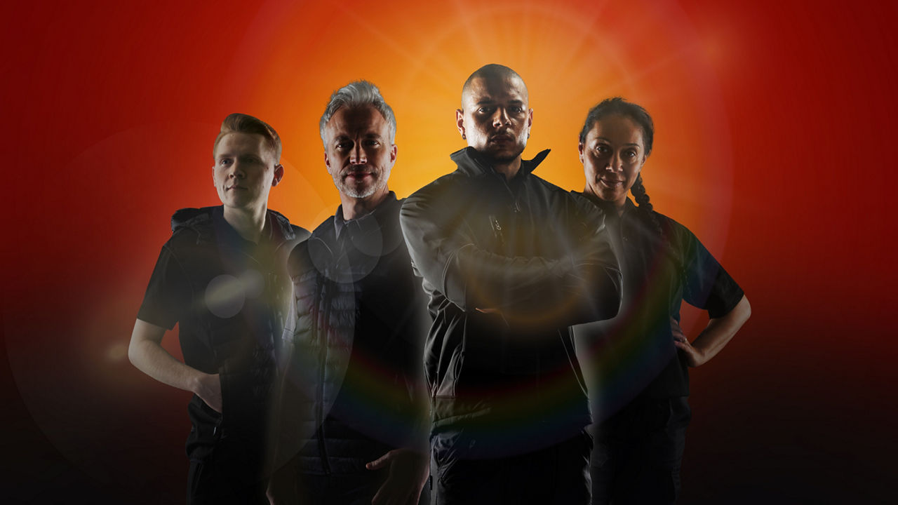 Four men from a dealers stood looking at camera in silhouette with detemined faces, ready to serve