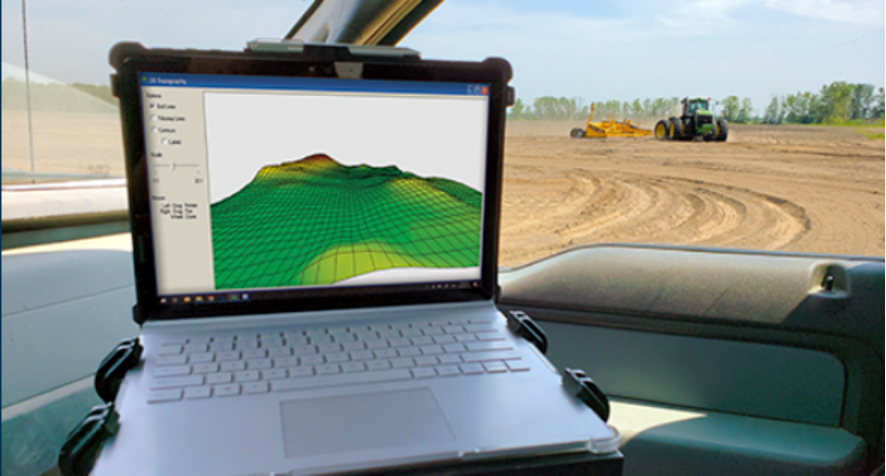 A tile plow and base station, ready for a drainage project