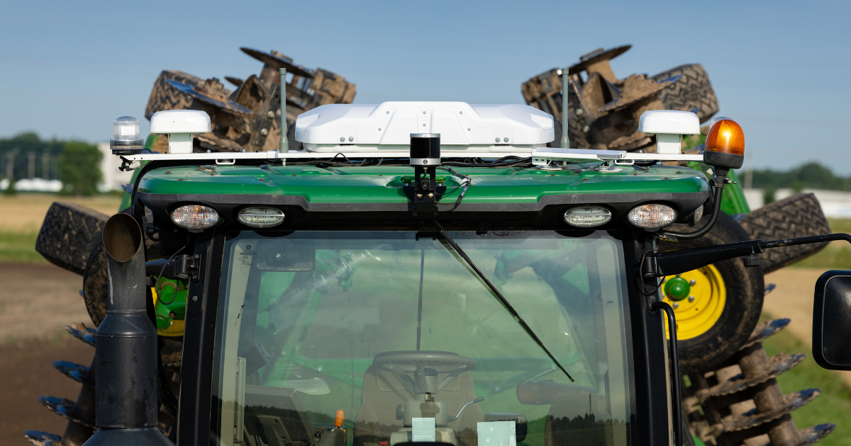 A man looks at FarmENGAGE on a cell phone