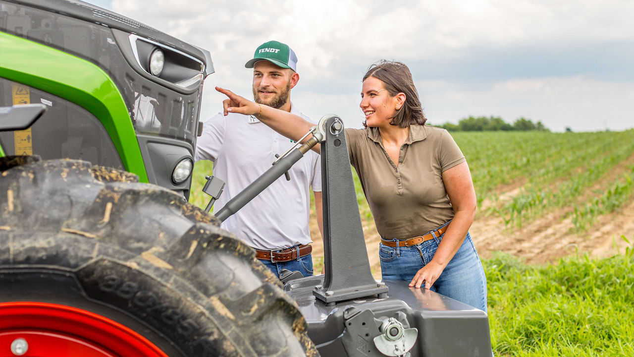 Male and Female farmers with a Fendt tractor