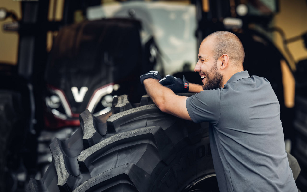 Smiling technician with Valtra