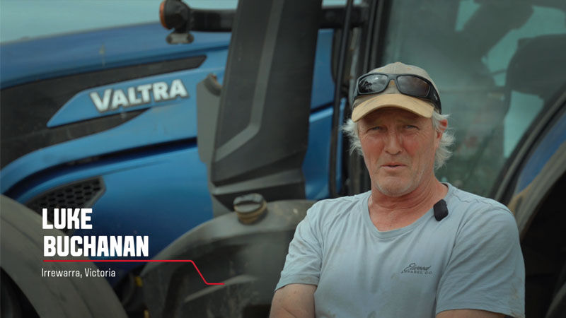 A Valtra customer from Victoria, Australia stands in front of his Valtra tractor