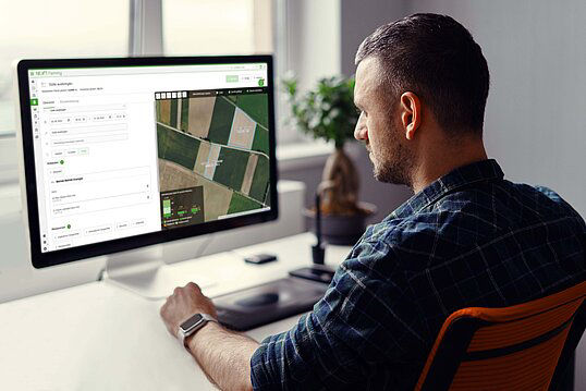 A farmer uses NEXT Farming software