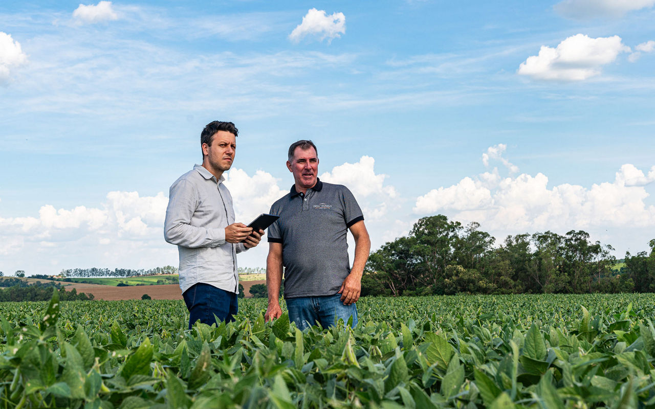 PTx Trimble, two men in field