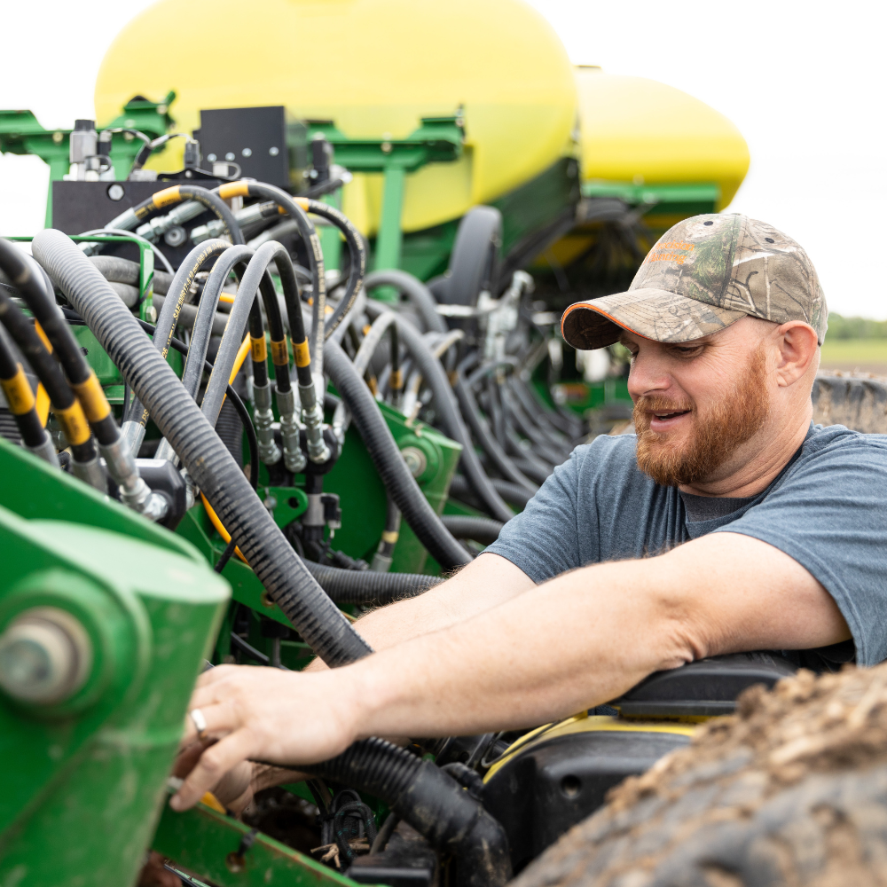A farmer works on his planter