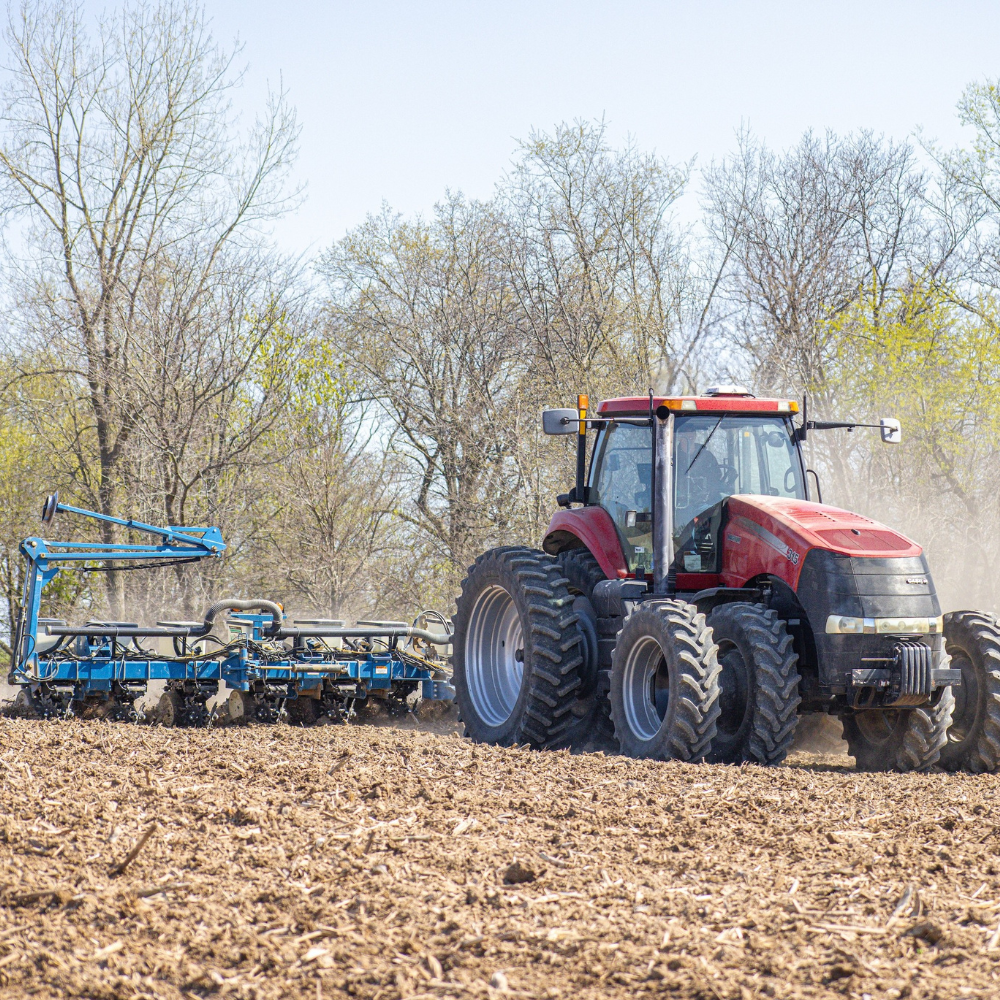 A tractor uses PTx Trimble technology in the field
