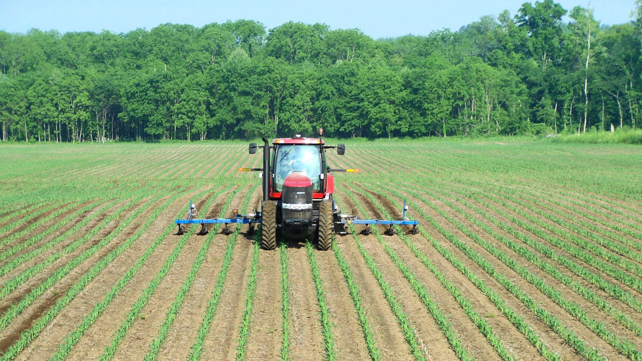 A tractor with the Field-IQ crop input control system installed