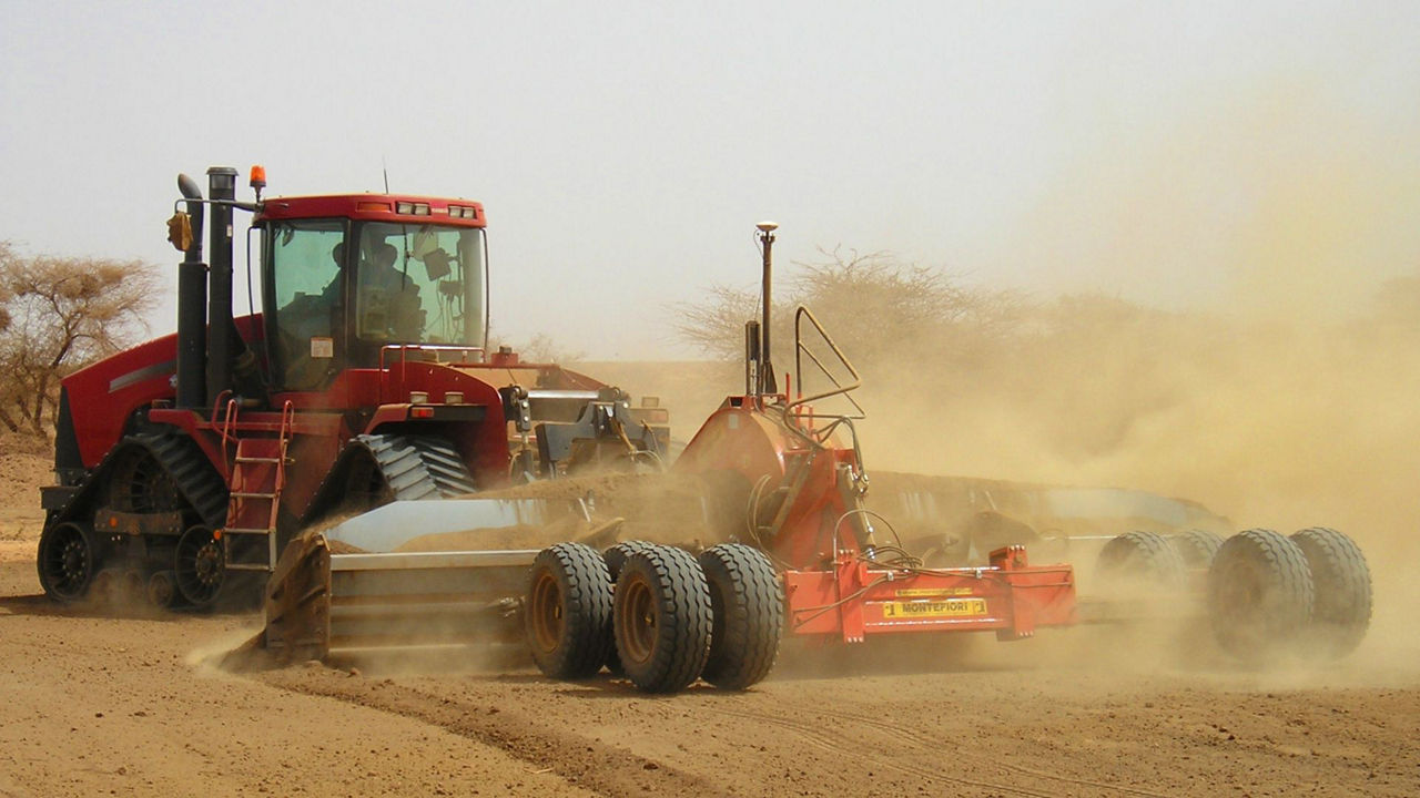 A tractor conducts landforming work.