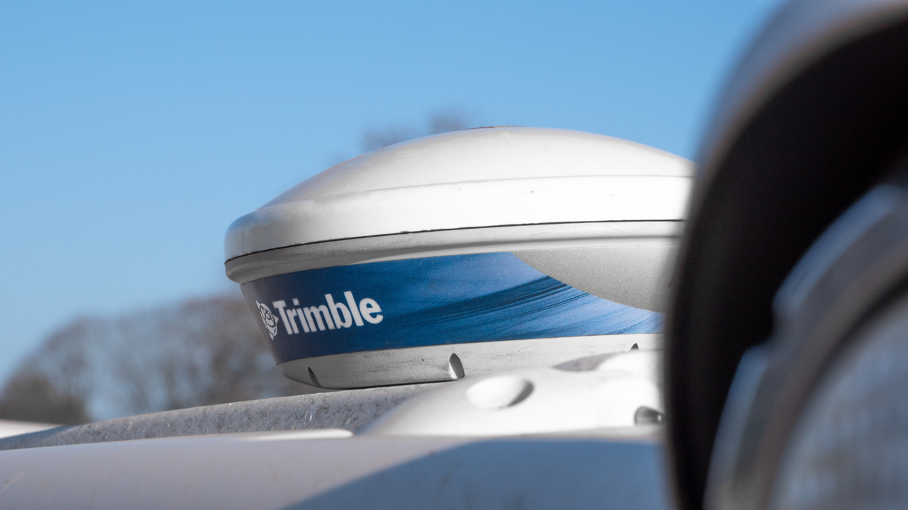 The PTx Trimble NAV-500 guidance controller on the roof of a tractor