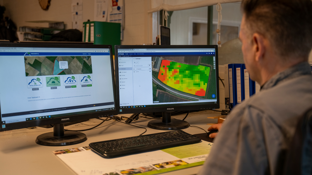 A farmer uses software from PTx Trimble