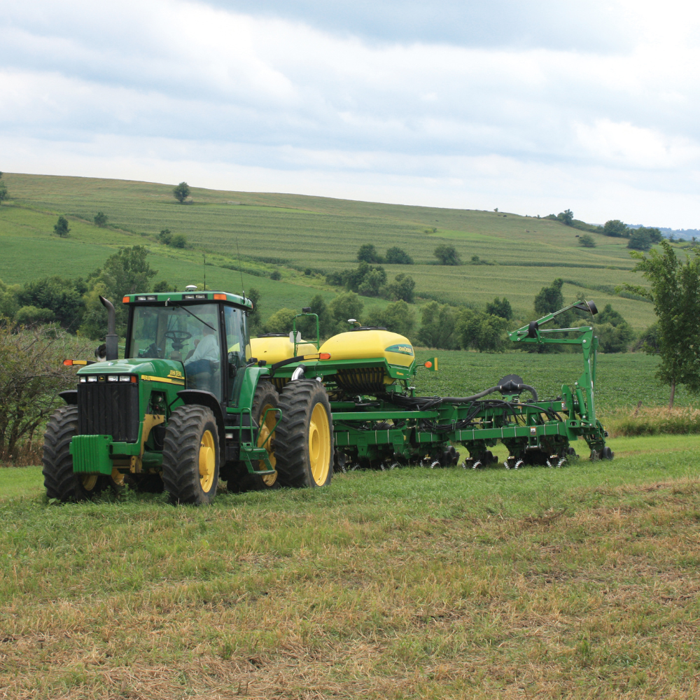 A tractor uses PTx Trimble TrueGuide technology to plant contours.