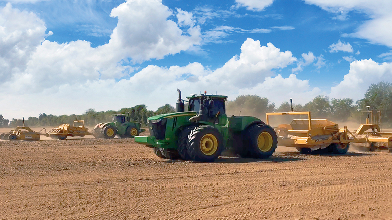 Tractors in the field using PTx Trimble's VerticalPoint RTK system.
