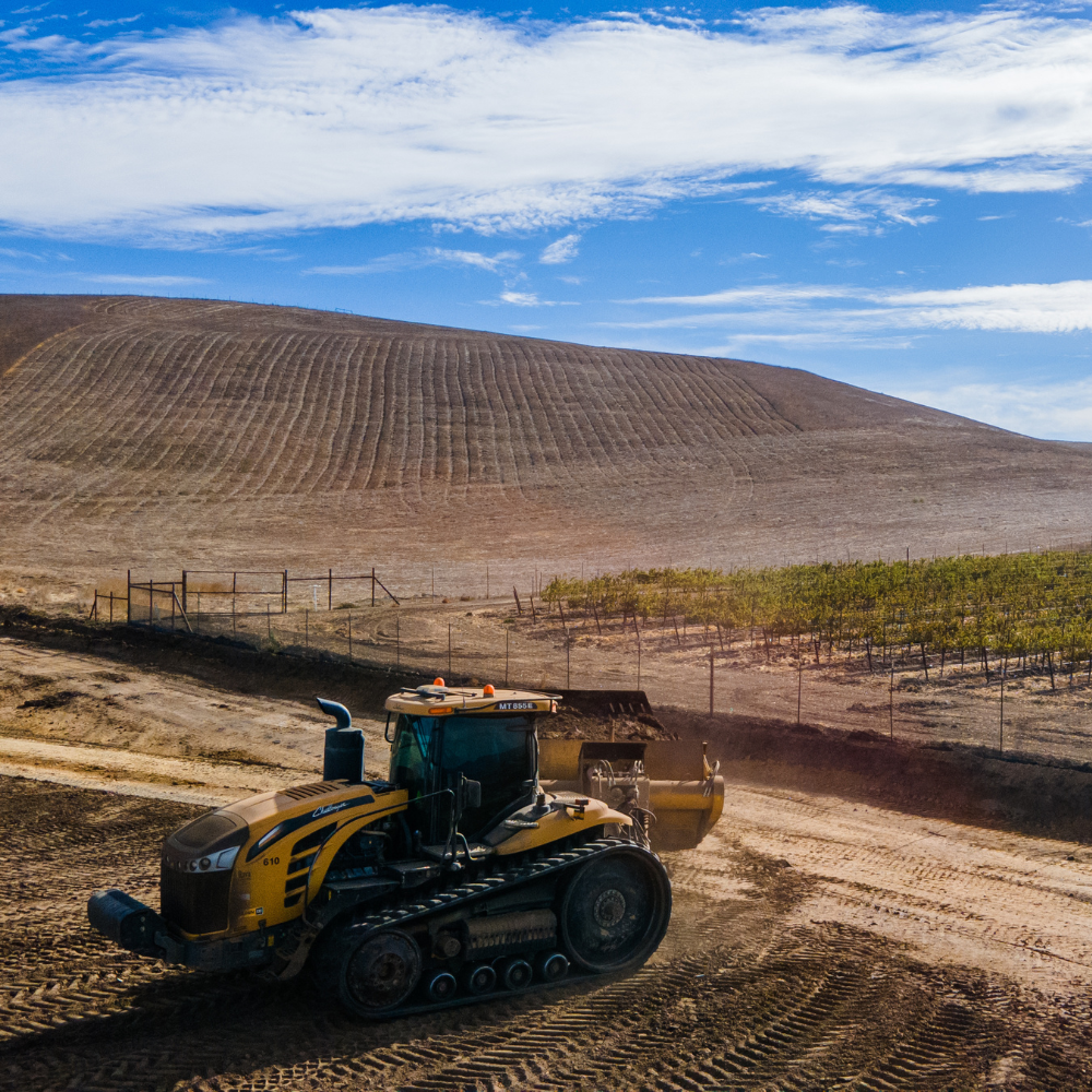 A tractor works a field with the PTx Trimble WM-FieldForm system.