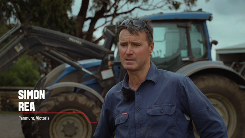 A Valtra customer from Victoria, Australia stands in front of his Valtra tractor