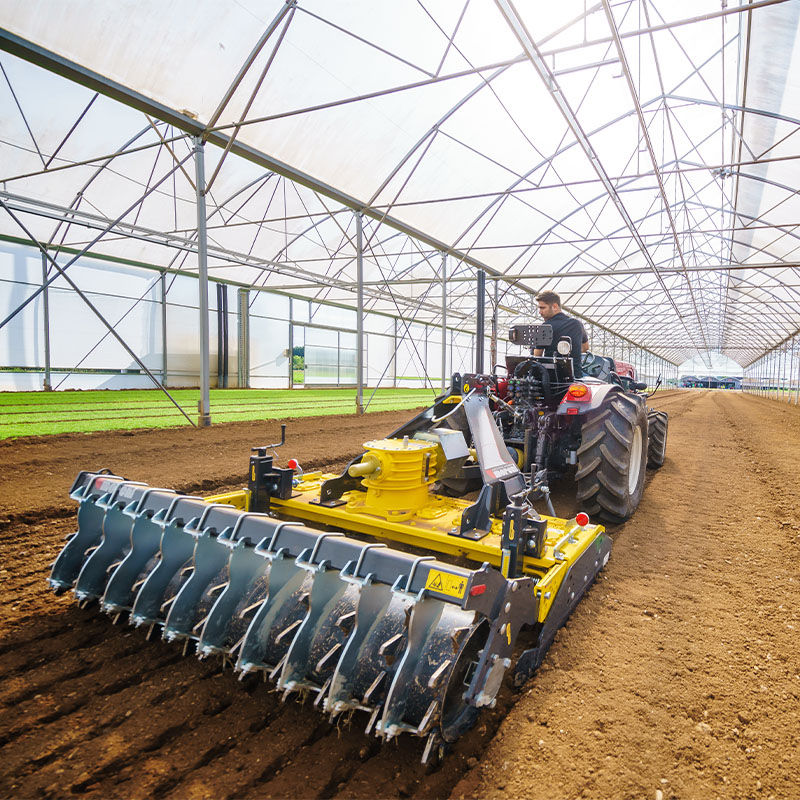 A 5th generation Valtra F Series working in a polytunnel
