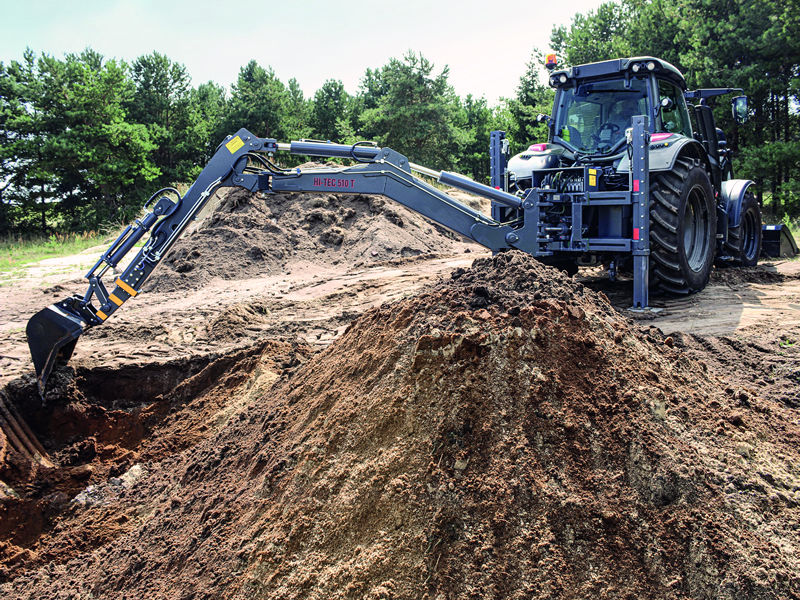 Valtra Traktor mit Kesla Kran und Grabschaufel