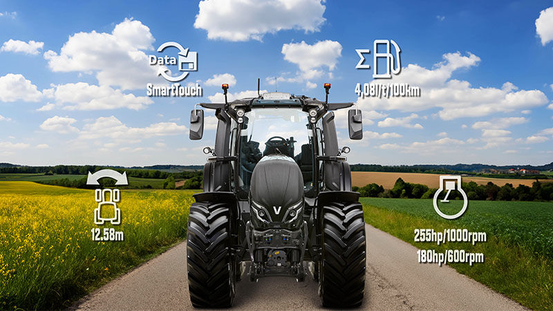 A Valtra Q285 driving on a country road.