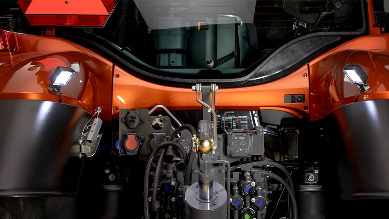 Work lights mounted to the rear mudguards of a Valtra tractor