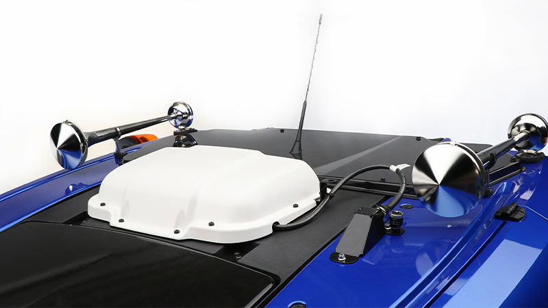 Compressed air horns on the roof of a Valtra tractor