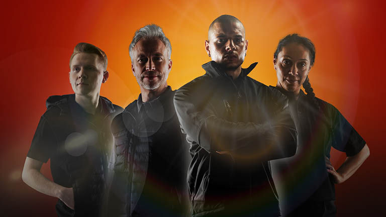 Three men and one woman stood looking into the camera looking competent and determind