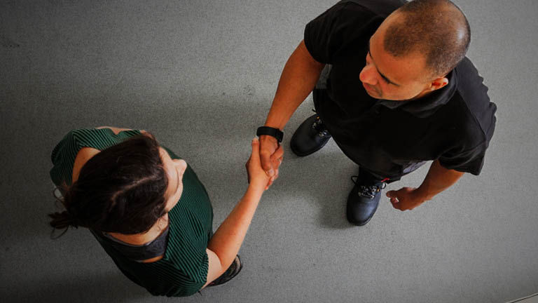 A top down view of two people shaking hands