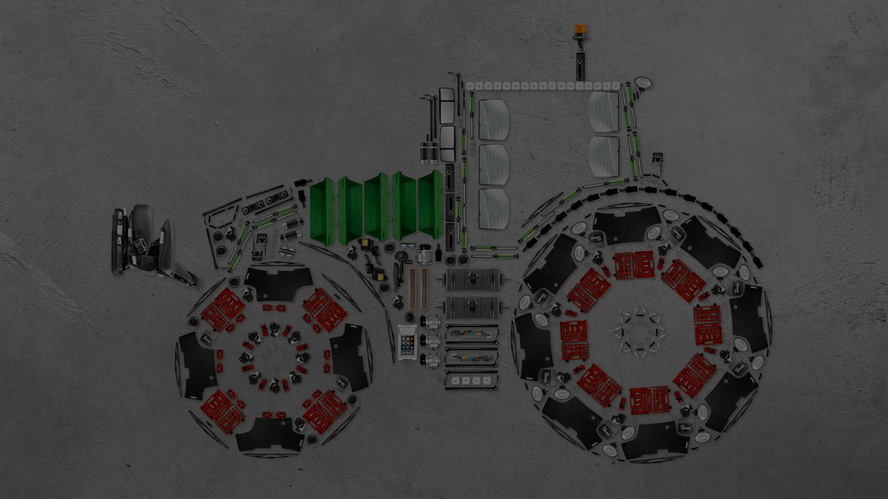 A flat lay style image of a Fendt tractor with parts visbile