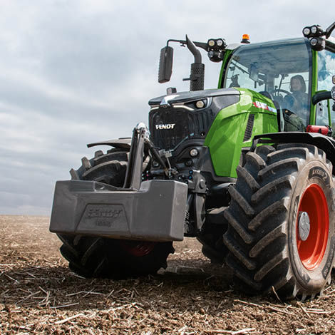 A Fendt tractor with a front weight attached