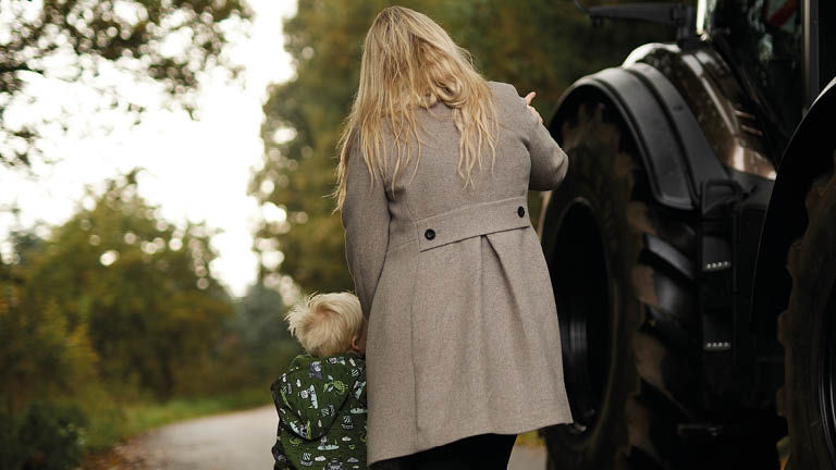 A woman and a child on a country lane