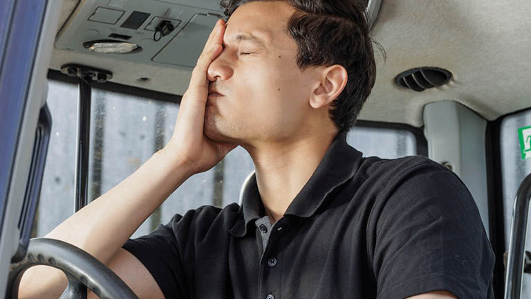 Man sitting inside a vehicle cabin