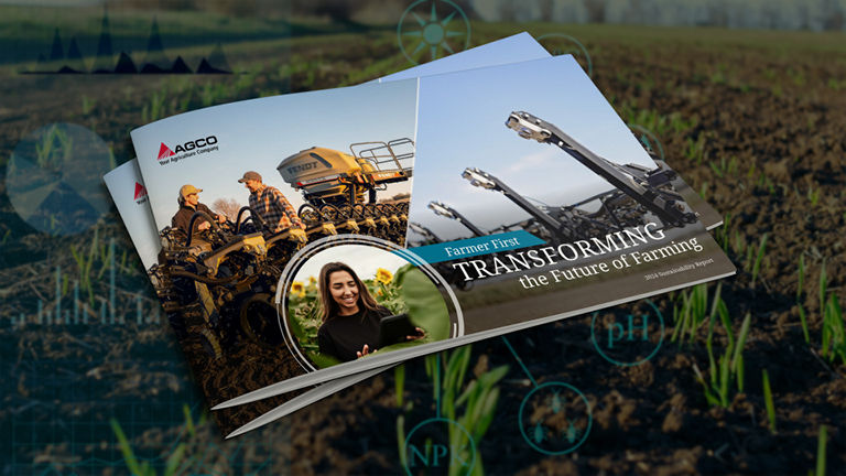 Two paper copies of the 2024 AGCO Sustainability report laying on grass