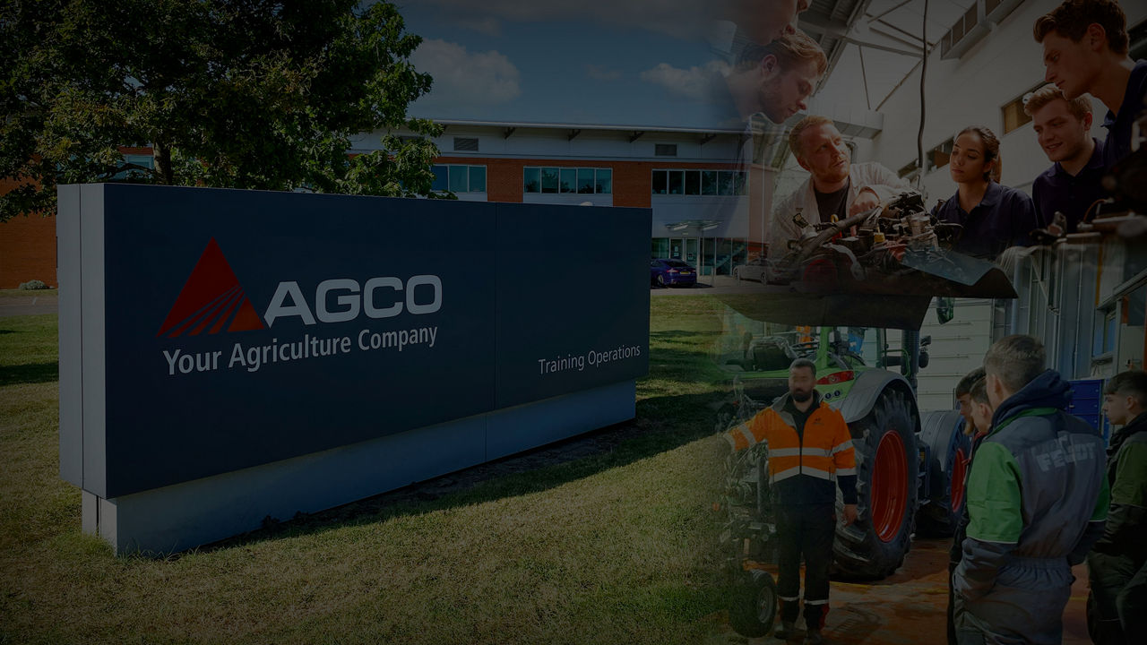 A sign for the AGCO Training Centre with various pieces of agriculutral equipment