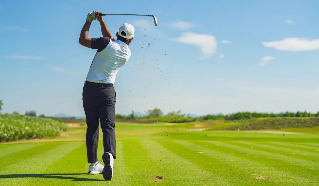 City Center on 7th Apartments - City Center, FL - A person playing golf