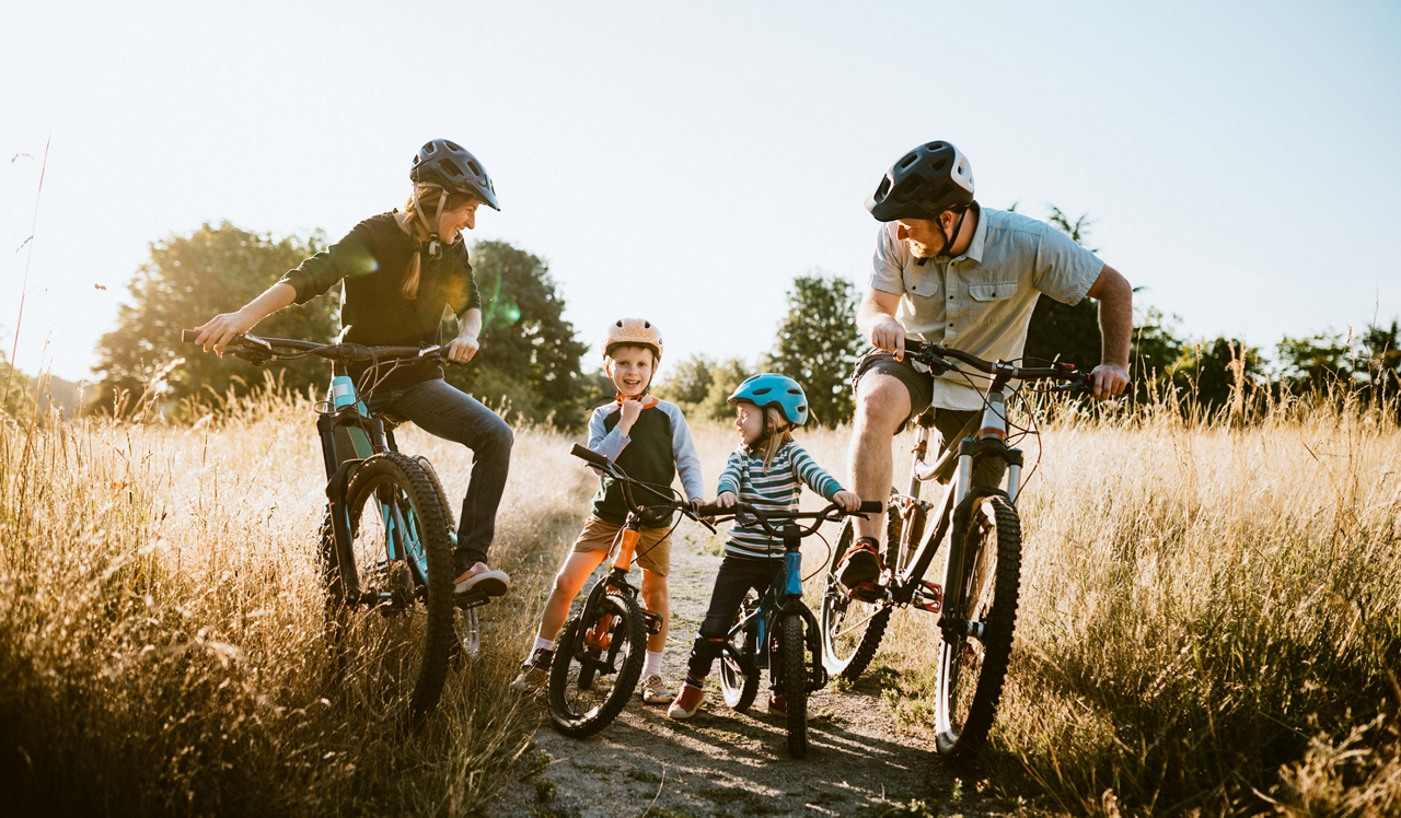 Oak Shore Homes - Corte Madera, CA - Family riding bikes on outdoor bike trail