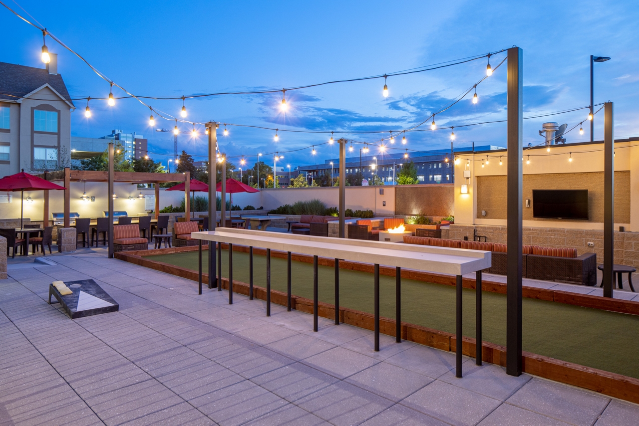 21 Fitzsimons - Aurora Co - Backyard Lounge.<div style="text-align: center;">&nbsp;</div>
<div style="text-align: center;">Host a game-day event in true backyard fashion with bocce ball, cornhole, fire pits, ping-pong, grills, and lounge seating.</div>
