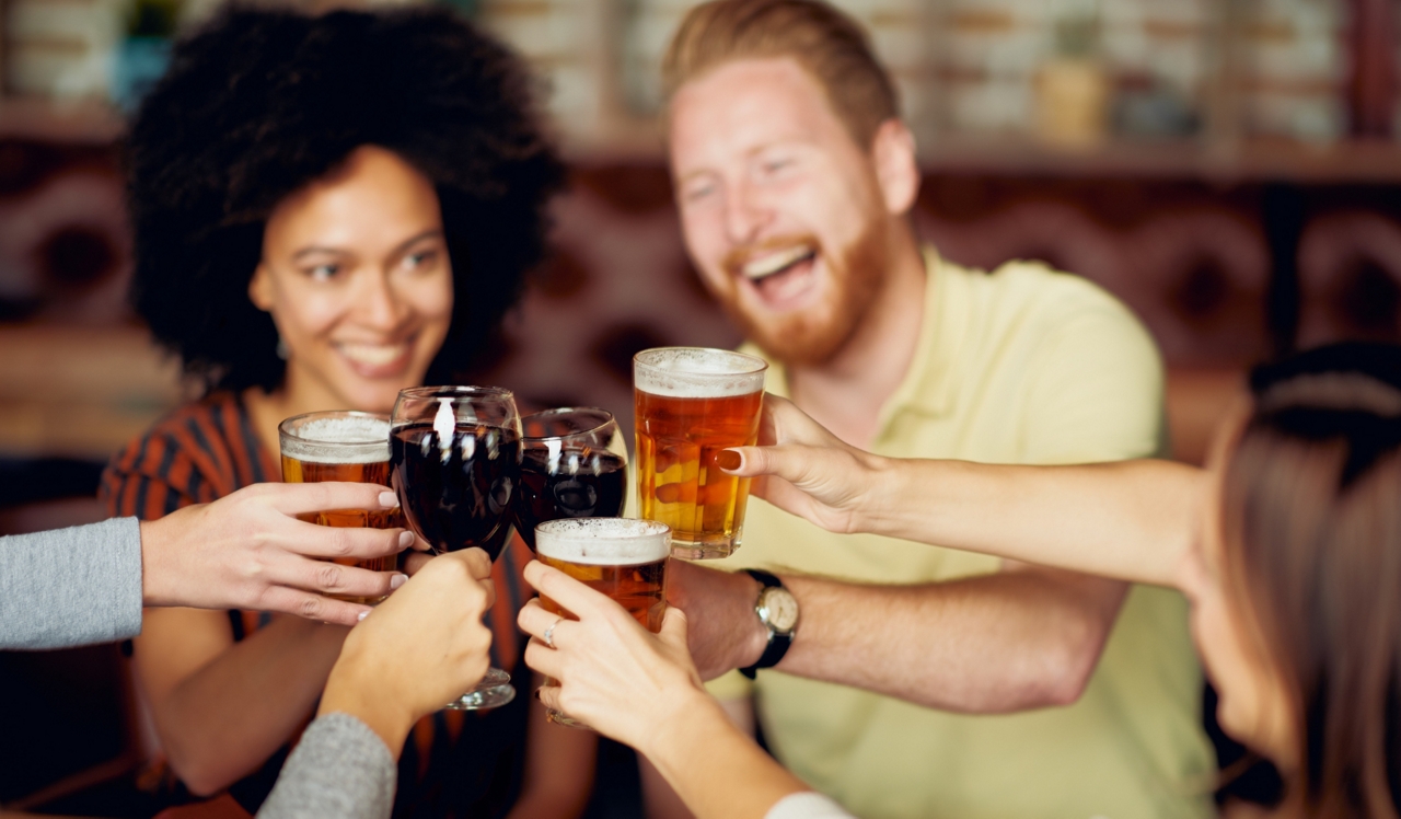 21 Fitzsimons - Aurora, CO - Friends cheersing beers at the brewery