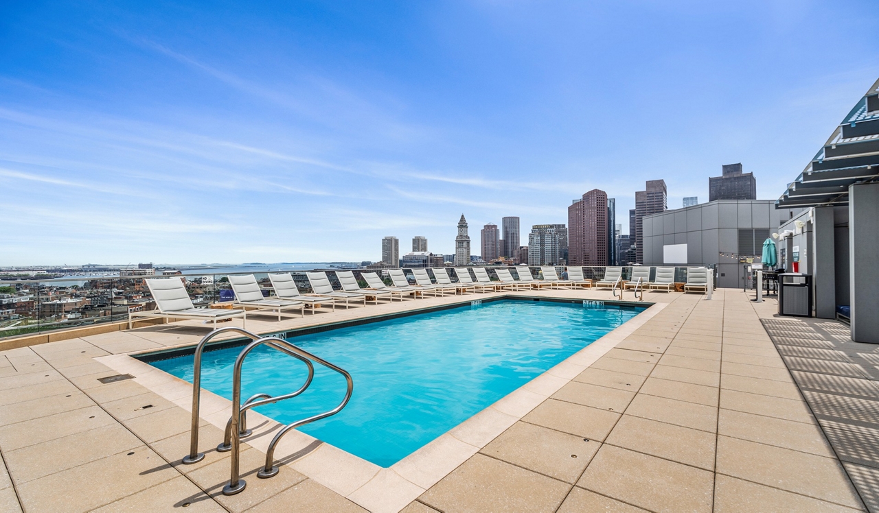 One Canal Apartment Homes - Boston, MA - Fireplace in font of pool deck