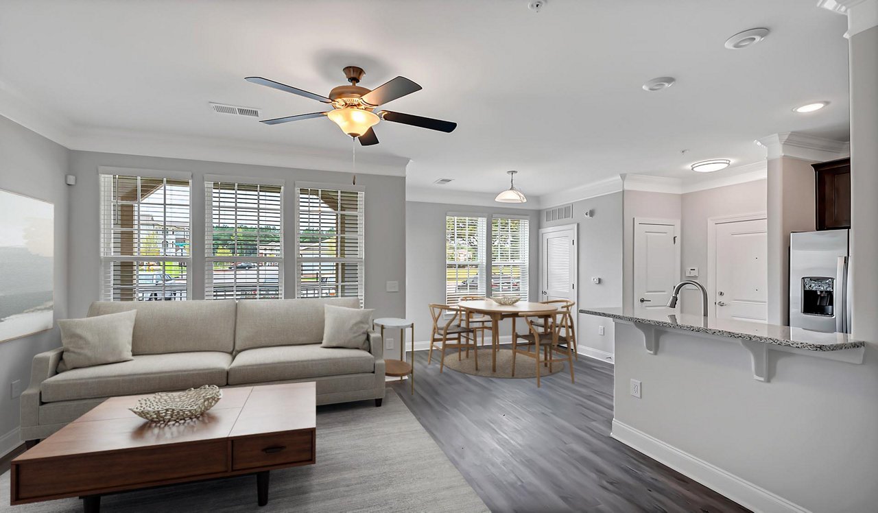 Spacious living room that opens up to the kitchen and patio