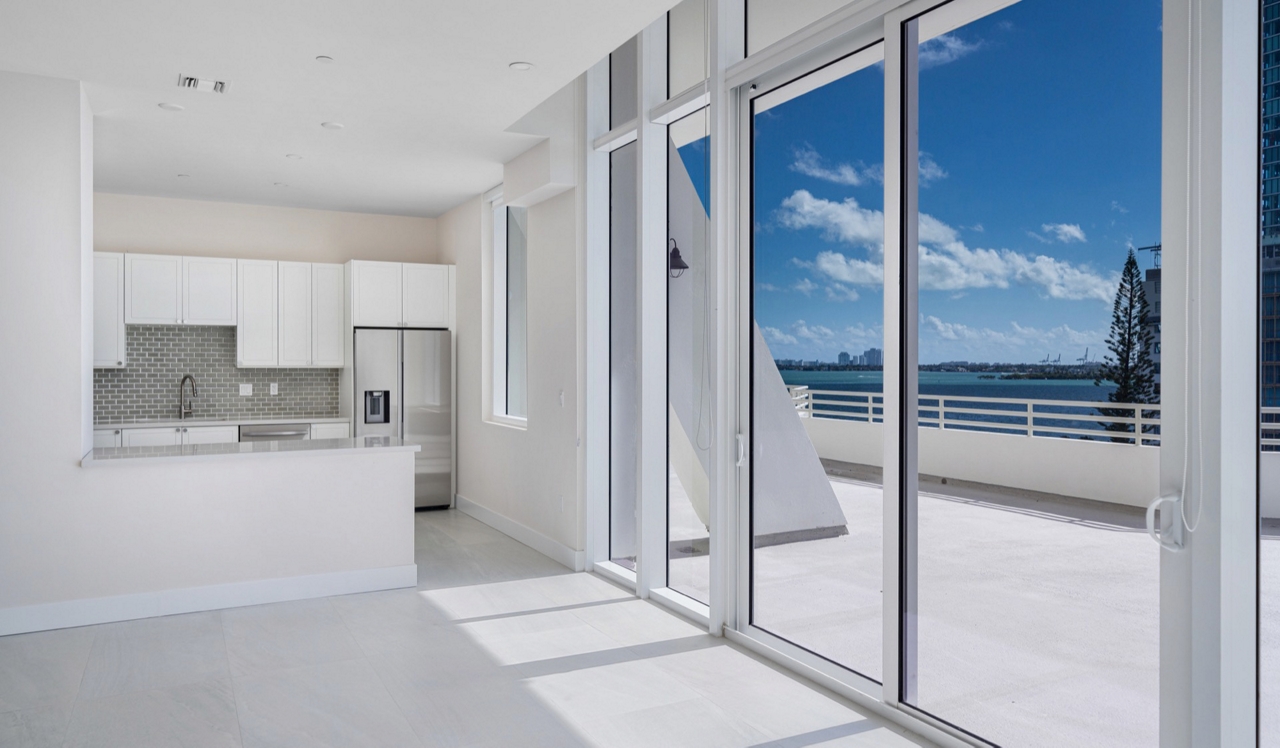 The Hamilton - Miami, FL - Kitchen and balcony with view
