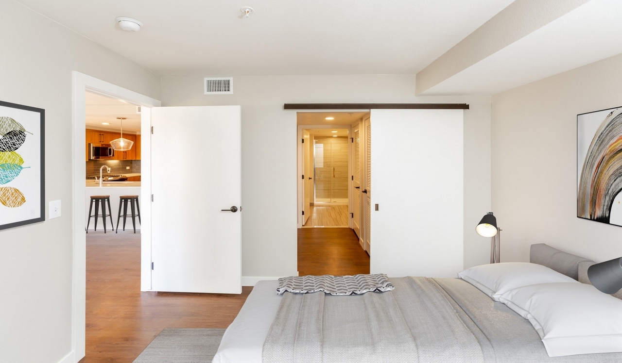 Parc Mosaic - Boulder, CO - Apartment Interior.Bedroom features a sliding barn door.