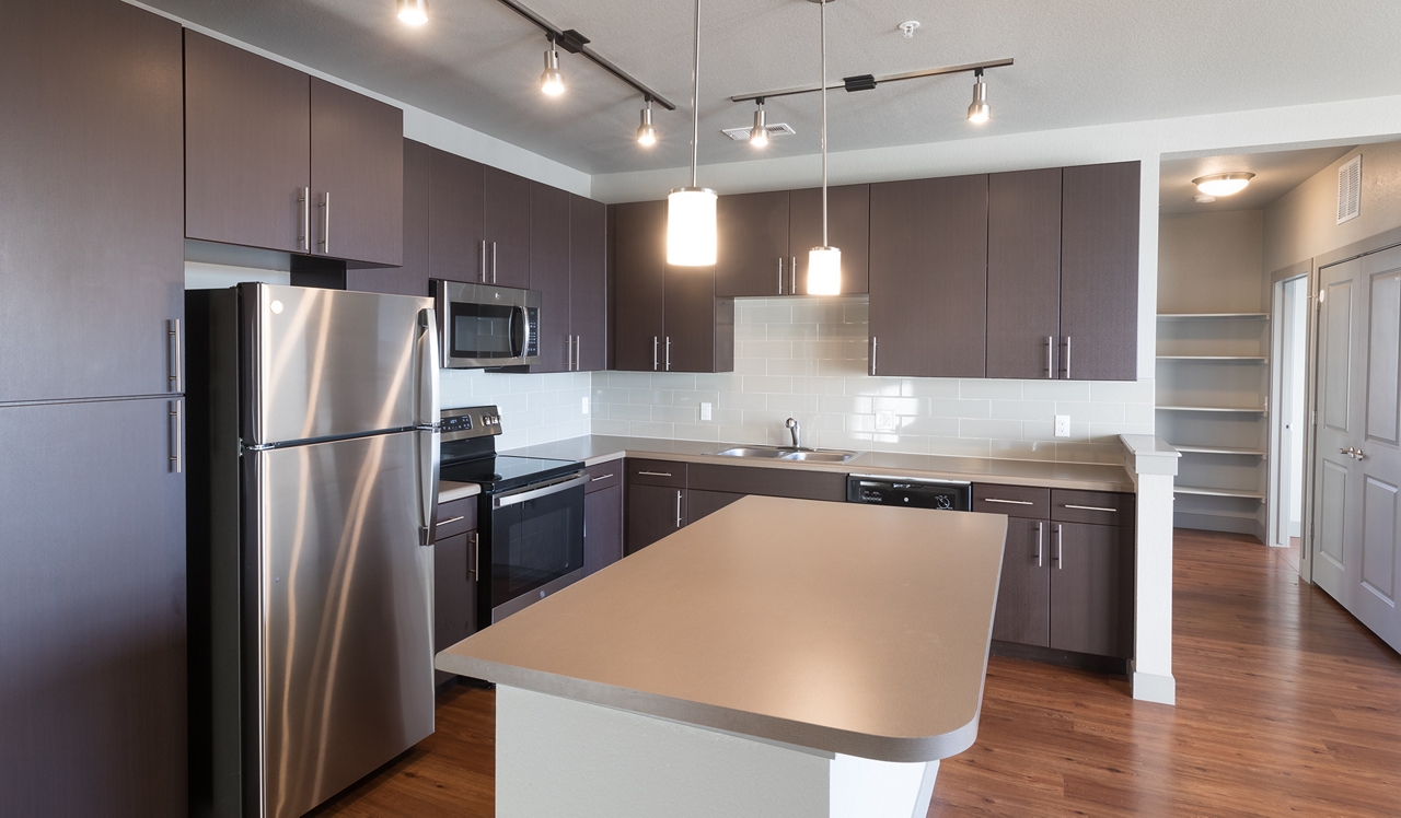 Aurora, CO Apartments for Rent - 21 Fitzsimons - Kitchen.<div style="text-align: center;">&nbsp;</div>
<div style="text-align: center;">Enjoy kitchens with stainless steel appliances and dark cabinetry in select homes.</div>
