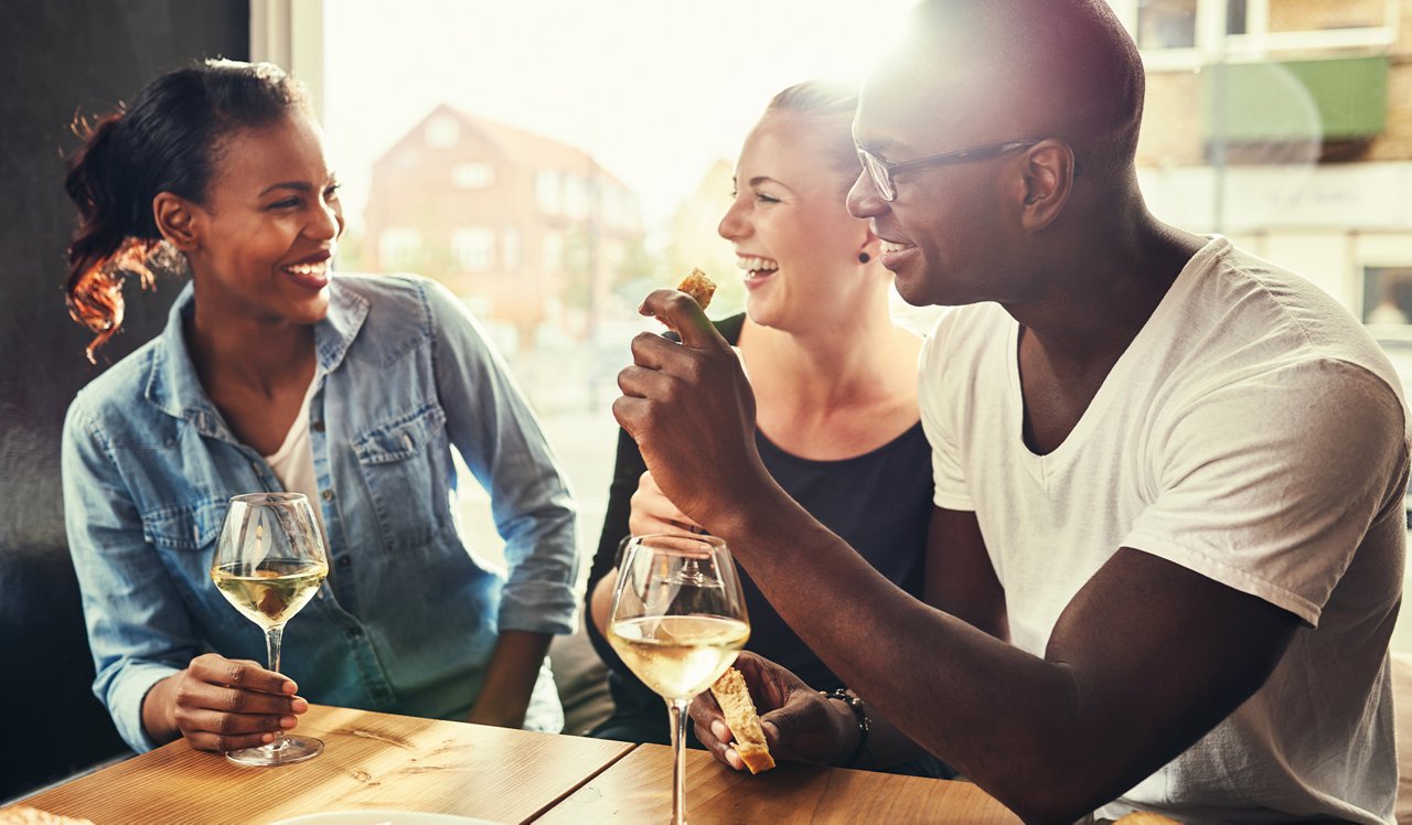 The Residences at Capital Crescent Trail - Bethesda, MD - Friends eating and drinking.<div style="text-align: center;">&nbsp;</div>
<div style="text-align: center;">Dining &amp; nightlife in Friendship Village just a 7-minute drive away.</div>
