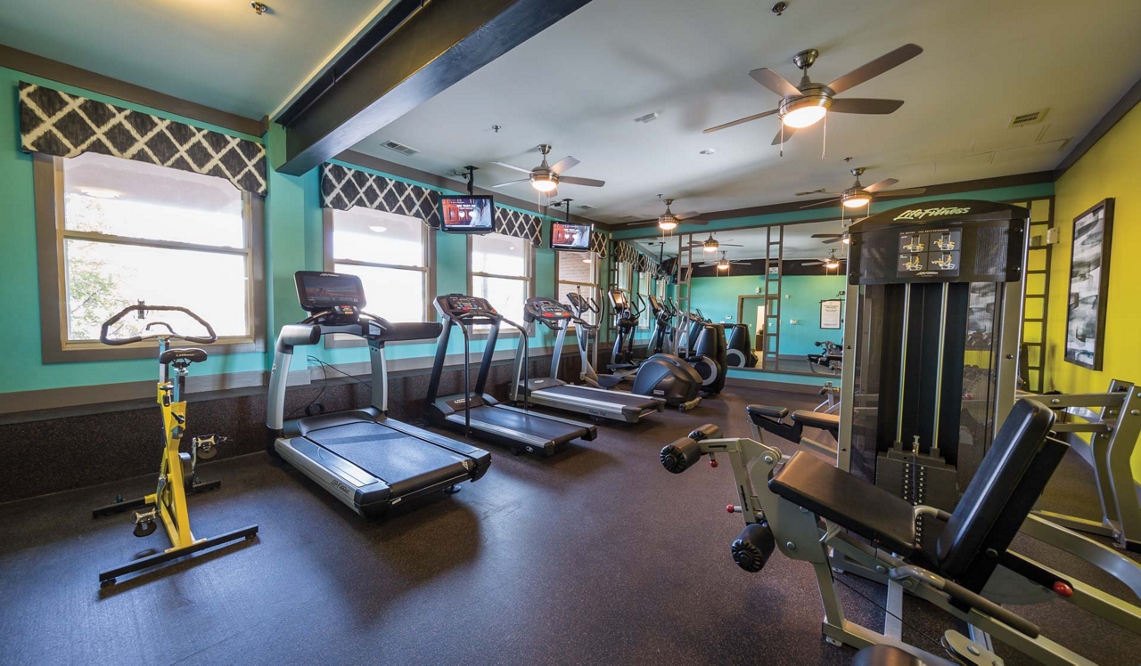 Tremont Apartments - Buckhead, Atlanta, GA - Person running on treadmill