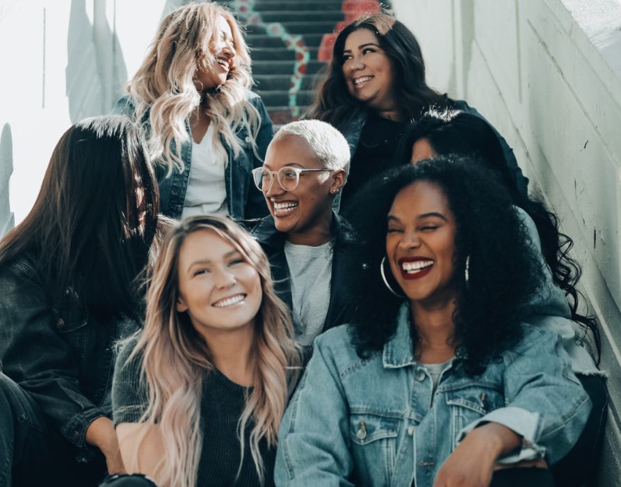 The Fremont Residences - Aurora, CO - Women with nice hair in a stairwell 