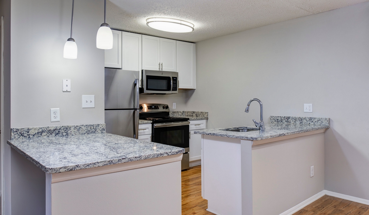 Burke Shire Commons Apartments - White Kitchen with Marbled Granite Countertops - Burke, Virginia