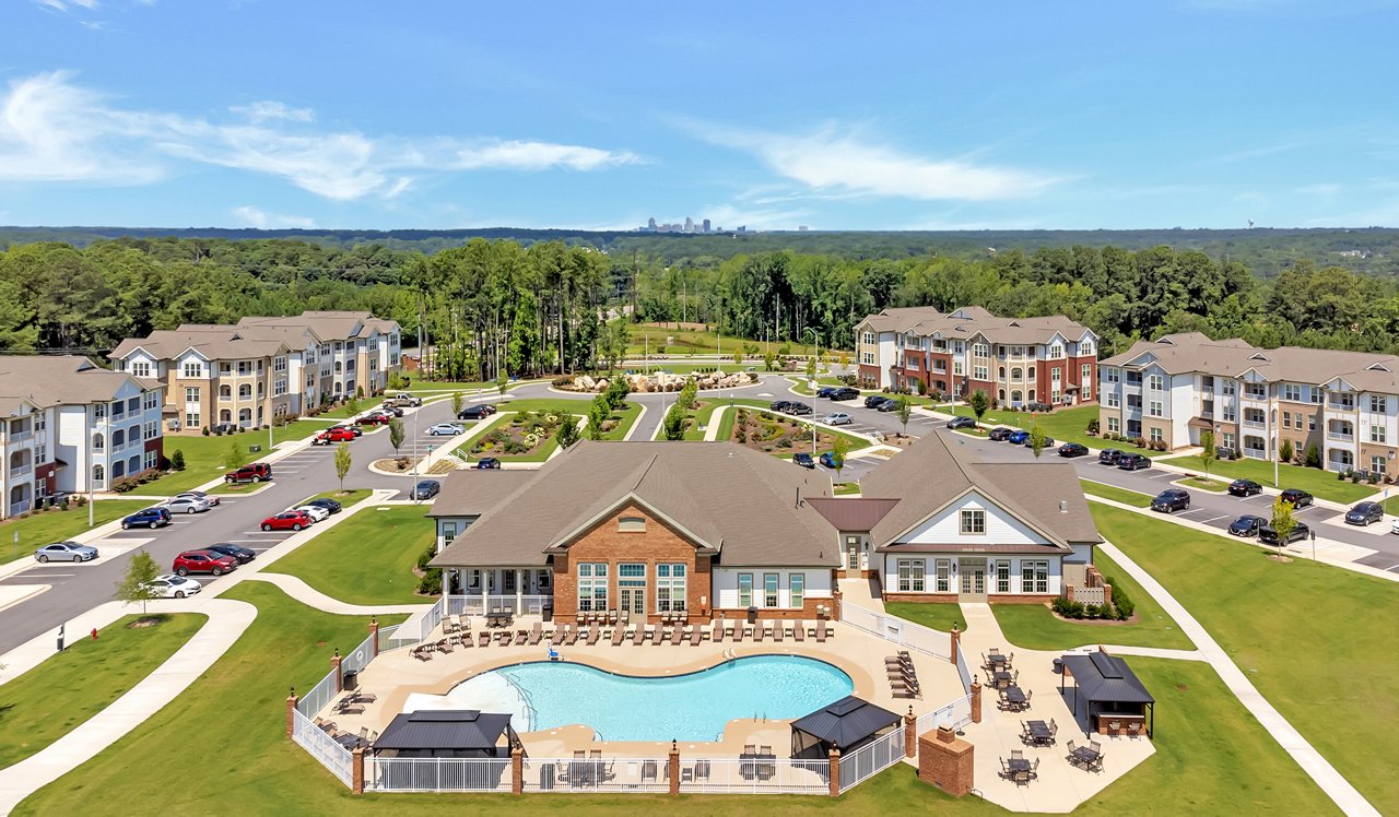 Bird's eye view of exterior of community and pool