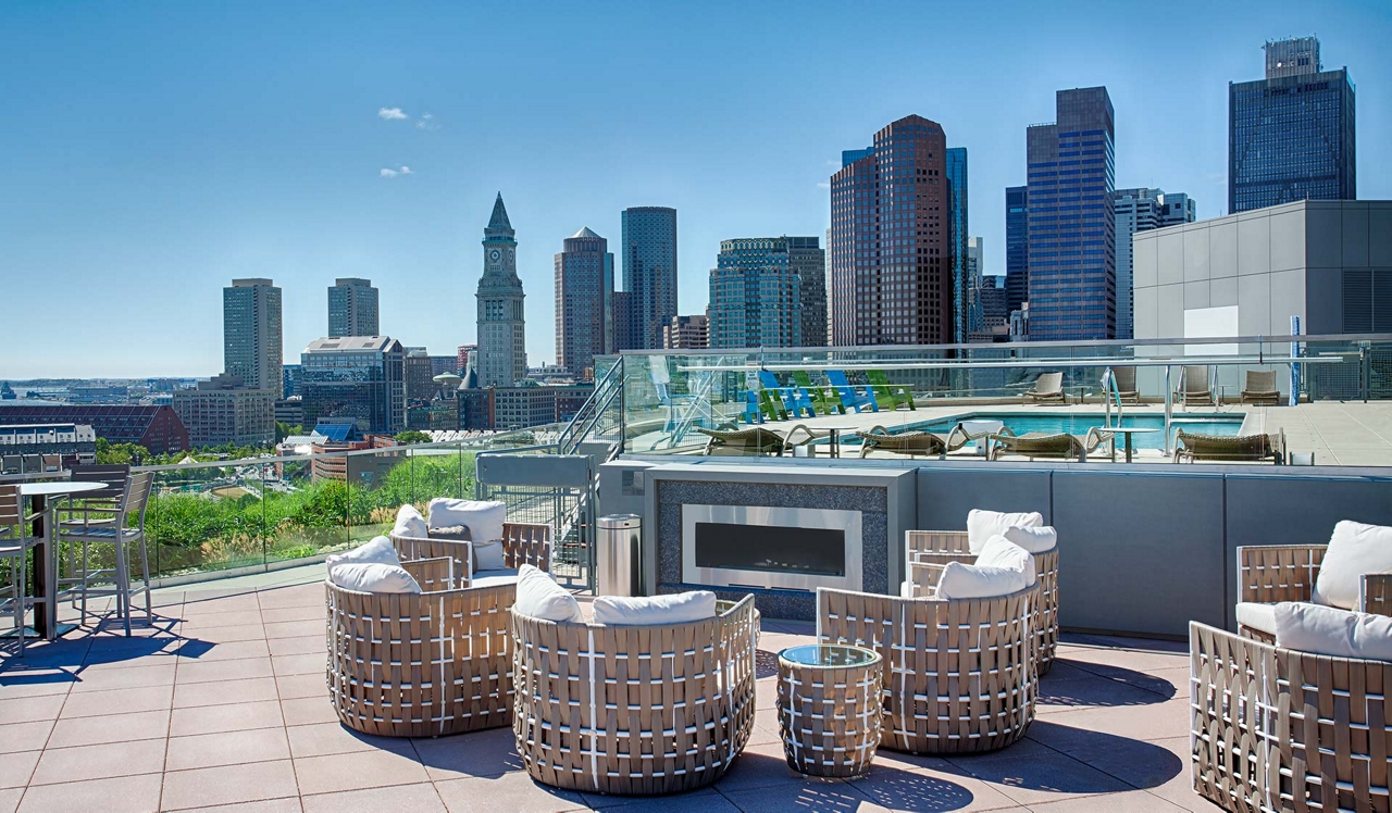 One Canal Apartment Homes - Boston, MA - Fireplace in font of pool deck