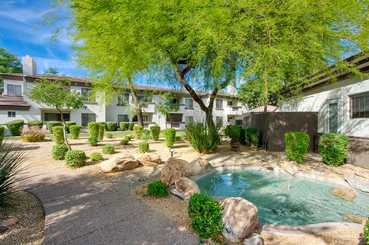 Landscaped courtyard with water feature at Indigo Creek