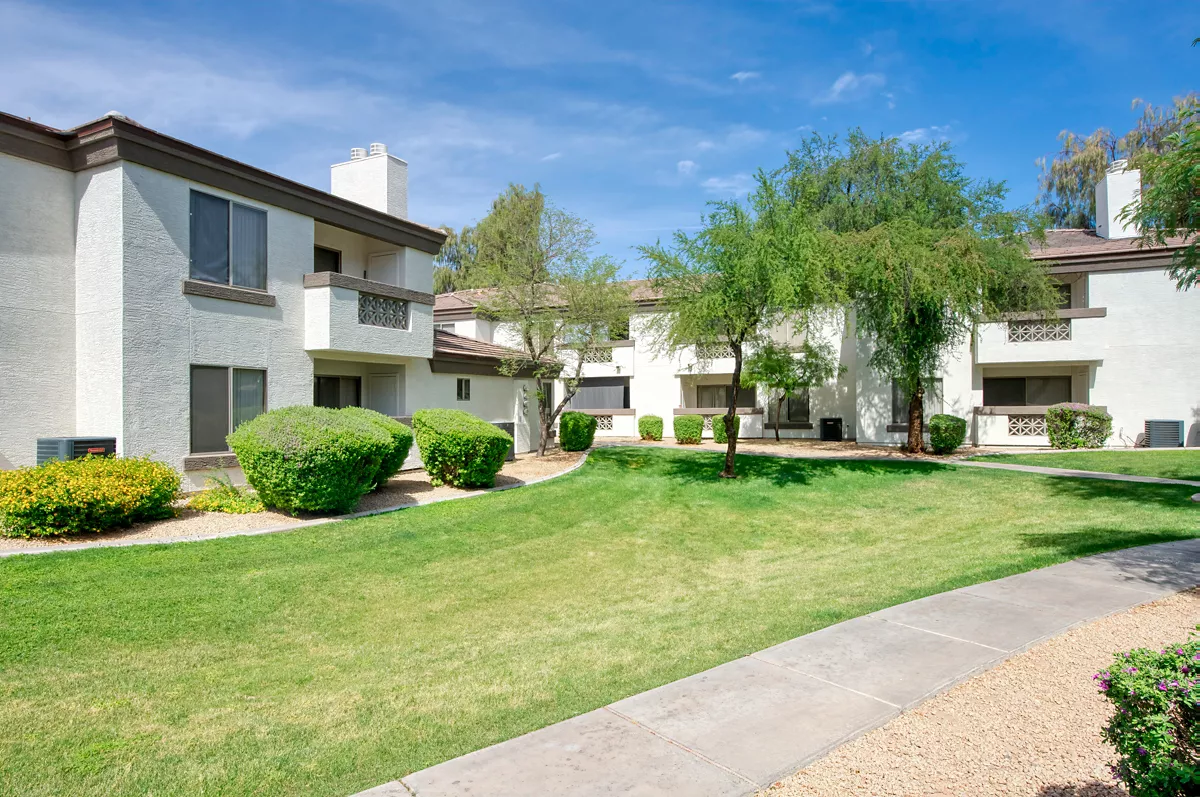Shared lawn and paths between apartment buildings at Indigo Creek