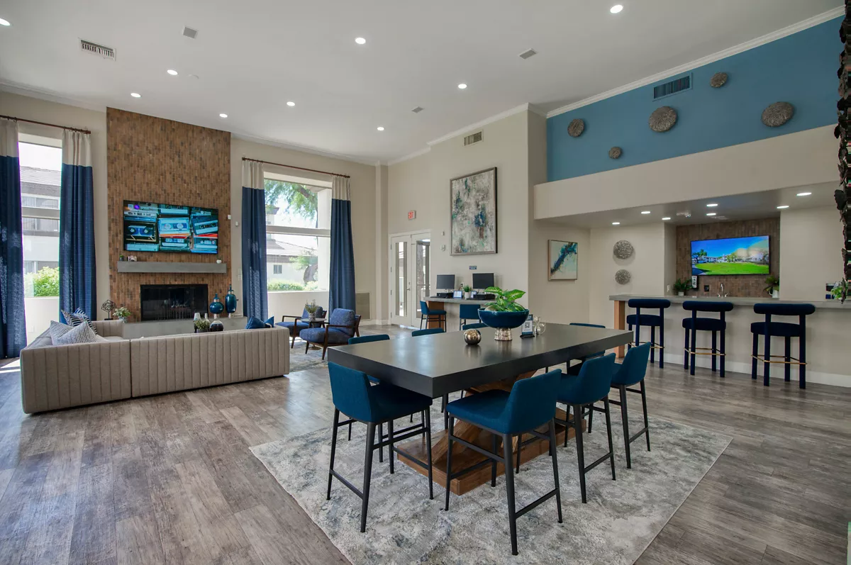 Community lounge and gathering tables at Indigo Creek