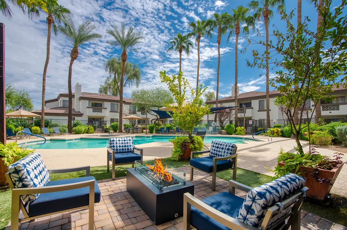 Poolside seating and fire table at Indigo Creek